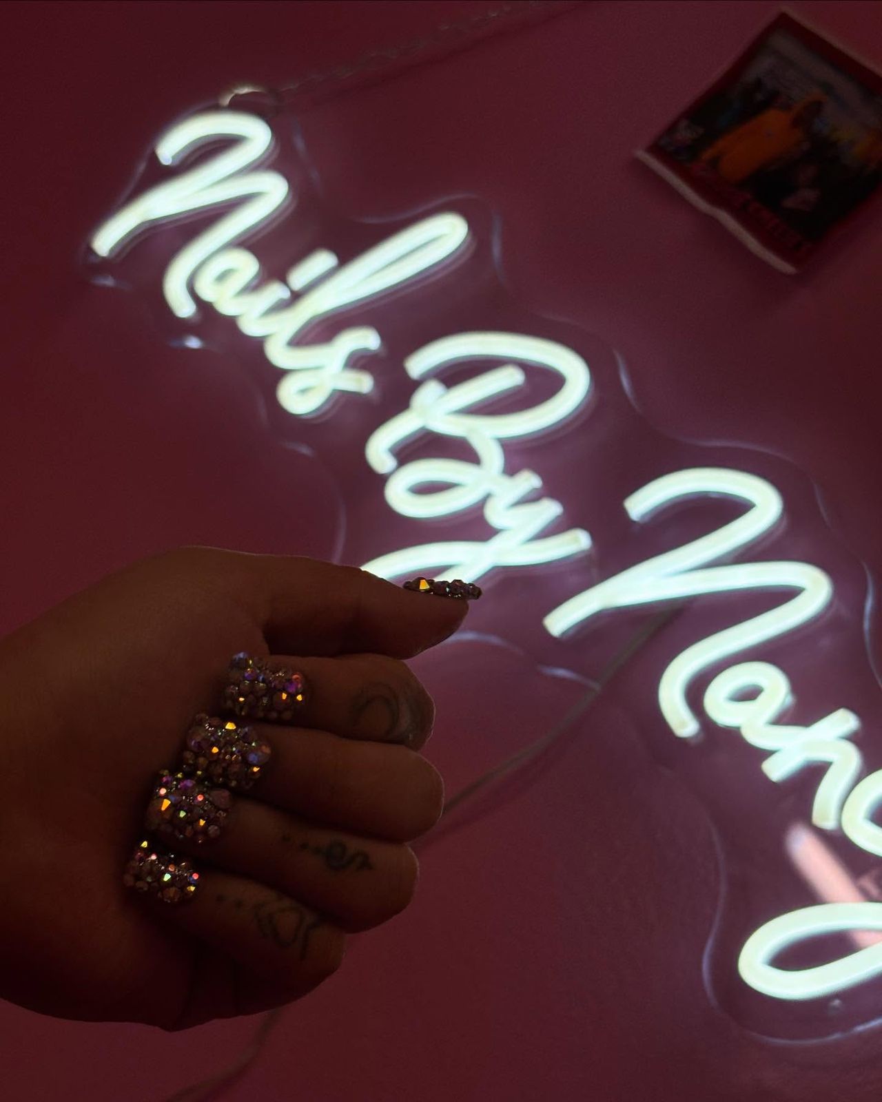 The Nails By Nancy neon sign in the studio