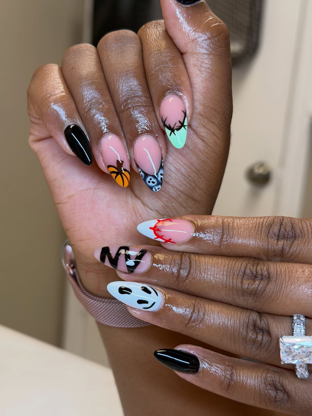 Halloween almond set with ghost faces, mint tips and black accents